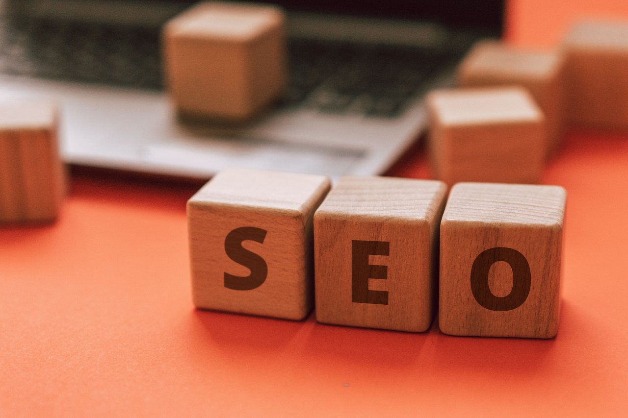 Mastering the First Impression: Your intriguing post title goes here Wooden blocks spelling SEO on a laptop keyboard convey digital marketing concepts.